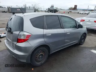 2009 Honda Fit with VIN JHMGE88279S055565, listed as a IAAI auction lot 41896359 with 184,618 mi miles. Bid and sale history available at carsss.com. Image 4.