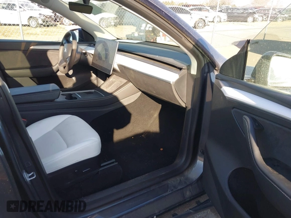 2023 Tesla Model Y Long Range with VIN 7SAYGAEEXPF714760, listed as a IAAI auction lot 41748398 with 49,802 mi miles and . Bid and sale history available at DreamBid. Image 5.