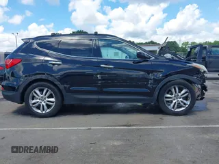 2013 Hyundai Santa Fe Sport z VIN 5XYZUDLA1DG050879, wystawiony jako IAAI lot #42236937 z przebiegiem 124 779 mil mil oraz . Historia ofert i sprzedaży dostępna na DreamBid. Obrazek 13.