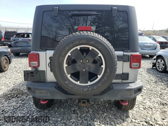 2015 Jeep Wrangler Unlimited Rubicon Hard Rock with VIN 1C4HJWFG4FL575054, listed as a Copart auction lot 51672655 with 130,405 mi miles and Clean title. Bid and sale history available at DreamBid. Image 6.