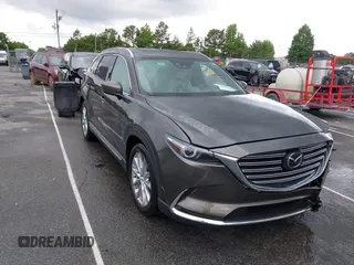 2016 Mazda CX-9 Grand Touring z VIN JM3TCADY6G0126391, wystawiony jako IAAI lot #42242541 z przebiegiem 45 147 mil mil oraz . Historia ofert i sprzedaży dostępna na DreamBid. Obrazek 1.