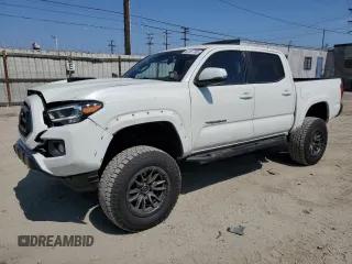 2021 Toyota Tacoma SR with VIN 3TMCZ5AN5MM418888, listed as a Copart auction lot 60167745 with 21,632 mi miles and Salvage title. Bid and sale history available at DreamBid. Image 1.