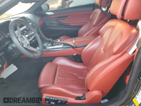 2017 BMW M6 z VIN WBS6J9C3XHD934858, wystawiony jako Copart lot #73714104 z przebiegiem Nie podano mil oraz Szkoda całkowita • Salvage title. Historia ofert i sprzedaży dostępna na DreamBid. Obrazek 7.