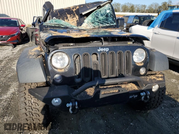 2015 Jeep Wrangler Willys Wheeler with VIN 1C4AJWAG8FL648645, listed as a Copart auction lot 74334884 with Not provided miles and Salvage title. Bid and sale history available at DreamBid. Image 5.