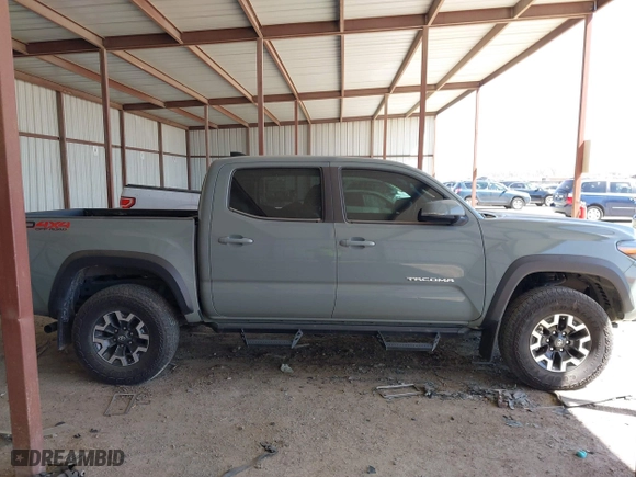 2023 Toyota Tacoma 4WD SR with VIN 3TMCZ5ANXPM613857, listed as a IAAI auction lot 41771957 with 76,232 mi miles. Bid and sale history available at carsss.com. Image 13.