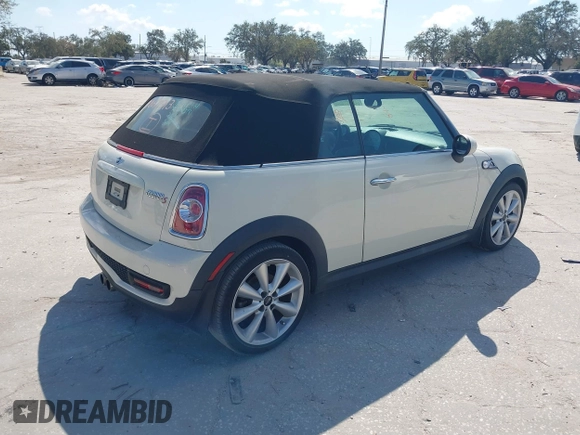2013 MINI Convertible S with VIN WMWZP3C51DT297843, listed as a IAAI auction lot 41527353 with 127,827 mi miles and . Bid and sale history available at DreamBid. Image 4.