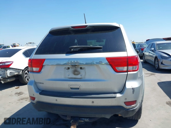 2012 Jeep Grand Cherokee Laredo with VIN 1C4RJEAG5CC112230, listed as a IAAI auction lot 41997483 with 302,923 mi miles. Bid and sale history available at carsss.com. Image 16.