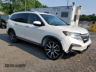 2019 Honda Pilot Elite with VIN 5FNYF6H09KB041935, listed as a Copart auction lot 60530515 with 57,526 mi miles and Salvage title. Bid and sale history available at DreamBid. Image 4.