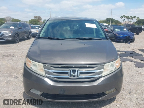 2012 Honda Odyssey Touring with VIN 5FNRL5H90CB088536, listed as a IAAI auction lot 42102008 with 283,350 mi miles and . Bid and sale history available at DreamBid. Image 12.