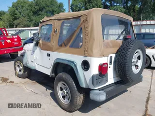 1998 Jeep Wrangler Sport z VIN 1J4FY19S3WP776209, wystawiony jako IAAI lot #42493513 z przebiegiem 113 130 mil mil oraz . Historia ofert i sprzedaży dostępna na DreamBid. Obrazek 3.