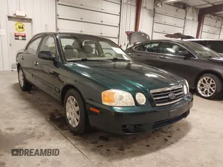 2004 Kia Optima LX z VIN KNAGD126545287271, wystawiony jako IAAI lot #41856404 z przebiegiem 83 303 mil mil oraz . Historia ofert i sprzedaży dostępna na DreamBid. Obrazek 1.
