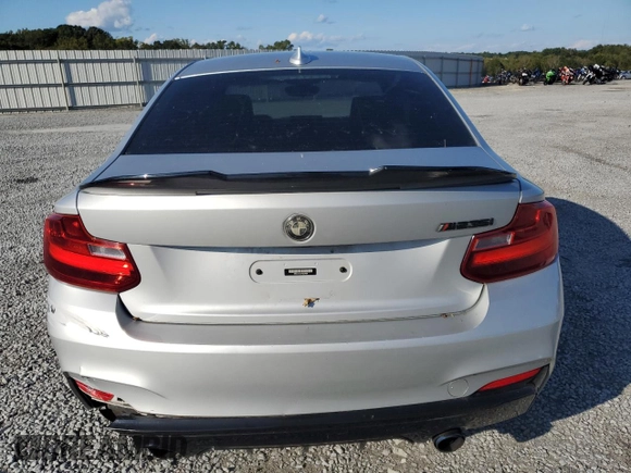2015 BMW 2 Series M235i with VIN WBA1J7C57FV254038, listed as a Copart auction lot 73657294 with 117,883 mi miles and Salvage Title. Bid and sale history available at carsss.com. Image 6.