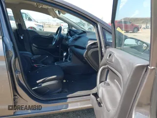 2014 Ford Fiesta SE z VIN 3FADP4BJ6EM117845, wystawiony jako IAAI lot #42431152 z przebiegiem 97 742 mil mil oraz . Historia ofert i sprzedaży dostępna na DreamBid. Obrazek 5.