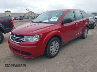 2014 Dodge Journey SE with VIN 3C4PDCAB2ET268532, listed as a IAAI auction lot 42056175 with 126,005 mi miles and . Bid and sale history available at carsss.com. Image 2.