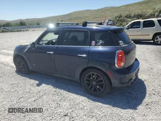 2013 MINI Countryman S ALL4 with VIN WMWZC5C50DWM15256, listed as a Copart auction lot 58080895 with 123,514 mi miles and Salvage title. Bid and sale history available at DreamBid. Image 2.