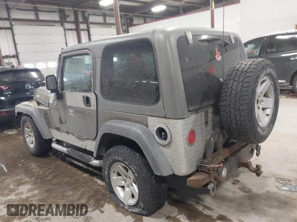 2005 Jeep Wrangler Rubicon with VIN 1J4FA69S65P311732, listed as a IAAI auction lot 41442147 with 174,277 mi miles. Bid and sale history available at carsss.com. Image 3.