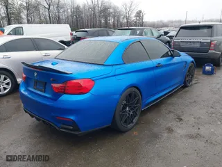 2015 BMW M4 with VIN WBS3U9C5XFJ968082, listed as a IAAI auction lot 41513593 with 57,715 mi miles. Bid and sale history available at carsss.com. Image 4.