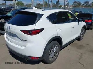 2020 Mazda CX-5 Grand Touring with VIN JM3KFADM0L1838495, listed as a IAAI auction lot 41991566 with 32,021 mi miles. Bid and sale history available at carsss.com. Image 4.