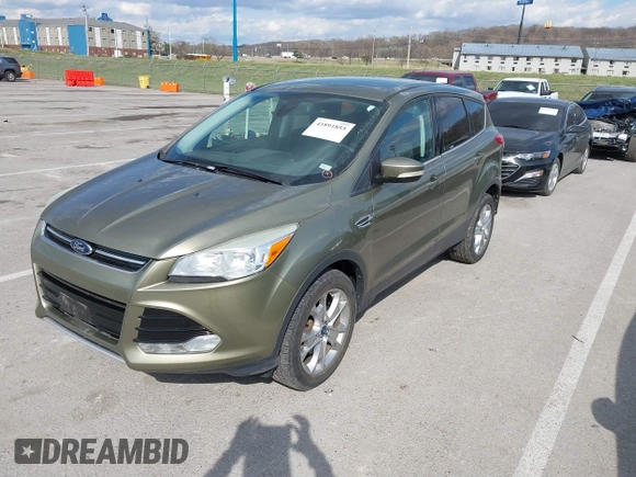 2013 Ford Escape SEL with VIN 1FMCU9H99DUC03956, listed as a IAAI auction lot 41891855 with 84,428 mi miles and . Bid and sale history available at DreamBid. Image 2.