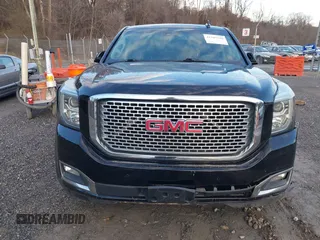 2016 GMC Yukon Denali with VIN 1GKS2CKJ2GR412201, listed as a IAAI auction lot 41185716 with 124,421 mi miles. Bid and sale history available at carsss.com. Image 12.