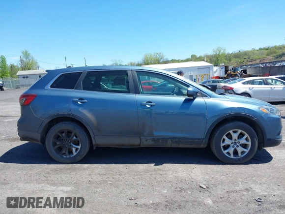2014 Mazda CX-9 Touring with VIN JM3TB3CV1E0447130, listed as a IAAI auction lot 40815387 with 148,985 mi miles. Bid and sale history available at carsss.com. Image 13.