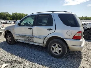 2001 Mercedes-Benz M-Class with VIN 4JGAB54EX1A271687, listed as a Copart auction lot 57046944 with 209,561 mi miles and Salvage Title. Bid and sale history available at carsss.com. Image 2.