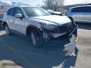2015 Mazda CX-5 Grand Touring with VIN JM3KE4DY5F0526335, listed as a IAAI auction lot 41756046 with NaN miles. Bid and sale history available at carsss.com. Image 1.