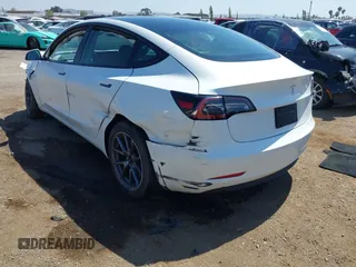 2023 Tesla Model 3 with VIN 5YJ3E1EA2PF571569, listed as a IAAI auction lot 42288715 with 30,271 mi miles and . Bid and sale history available at DreamBid. Image 3.