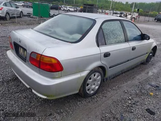 1999 Honda Civic DX with VIN 1HGEJ6628XL028492, listed as a IAAI auction lot 42071358 with 285,769 mi miles. Bid and sale history available at carsss.com. Image 4.