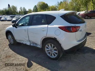 2014 Mazda CX-5 Grand Touring with VIN JM3KE4DY2E0354795, listed as a Copart auction lot 54205775 with 62,939 mi miles and Salvage Title. Bid and sale history available at DreamBid. Image 2.