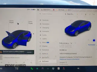 2020 Tesla Model Y Long Range with VIN 5YJYGDEE4LF030103, listed as a IAAI auction lot 41328929 with 64,896 mi miles and . Bid and sale history available at DreamBid. Image 7.