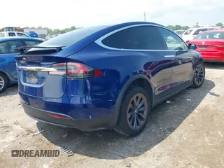 2018 Tesla Model X 75D with VIN 5YJXCAE21JF132628, listed as a IAAI auction lot 42081282 with 35,360 mi miles and . Bid and sale history available at carsss.com. Image 4.