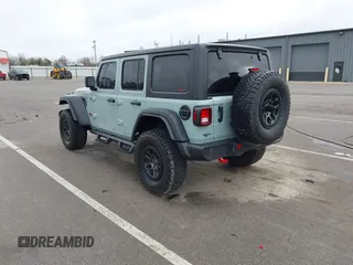 2023 Jeep Wrangler Rubicon with VIN 1C4JJXFG7PW654564, listed as a IAAI auction lot 41833534 with 22,277 mi miles and . Bid and sale history available at DreamBid. Image 3.