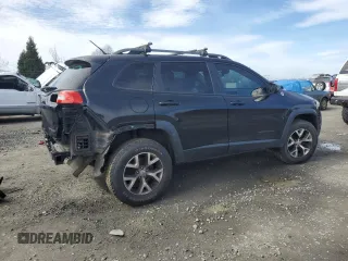 2014 Jeep Cherokee Trailhawk with VIN 1C4PJMBS9EW159993, listed as a Copart auction lot 46935105 with 128,140 mi miles and Salvage Title. Bid and sale history available at carsss.com. Image 3.