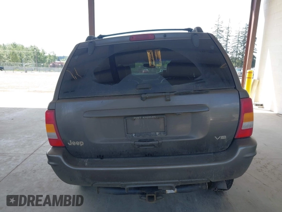 1999 Jeep Grand Cherokee Limited z VIN 1J4GW68N0XC512229, wystawiony jako IAAI lot #42189815 z przebiegiem 230 028 mil mil oraz . Historia ofert i sprzedaży dostępna na DreamBid. Obrazek 17.