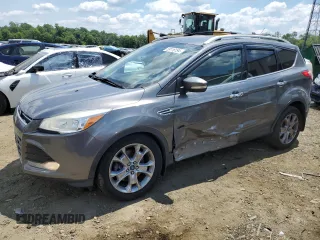 2014 Ford Escape Titanium with VIN 1FMCU9J91EUC90702, listed as a Copart auction lot 59116194 with 117,984 mi miles and Salvage Title. Bid and sale history available at DreamBid. Image 1.
