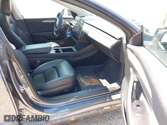 2023 Tesla Model 3 z VIN 5YJ3E1EA0PF655244, wystawiony jako IAAI lot #42004592 z przebiegiem 54 860 mil mil oraz . Historia ofert i sprzedaży dostępna na DreamBid. Obrazek 5.