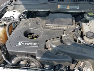 2014 Ford Fusion Titanium Hybrid with VIN 3FA6P0RU0ER329063, listed as a IAAI auction lot 40072913 with 210,274 mi miles. Bid and sale history available at carsss.com. Image 10.