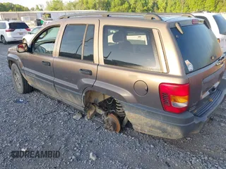 2002 Jeep Grand Cherokee with VIN 1J4GW38N42C202219, listed as a IAAI auction lot 42035162 with 220,012 mi miles and . Bid and sale history available at DreamBid. Image 3.