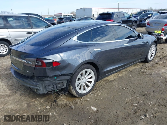2017 Tesla Model S 100D with VIN 5YJSA1E23HF198592, listed as a IAAI auction lot 41721755 with 127,946 mi miles. Bid and sale history available at carsss.com. Image 4.