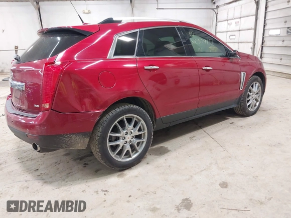 2014 Cadillac SRX Performance Collection z VIN 3GYFNCE30ES596415, wystawiony jako IAAI lot #42329771 z przebiegiem 71 620 mil mil oraz . Historia ofert i sprzedaży dostępna na DreamBid. Obrazek 4.