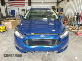 2018 Ford Focus SE z VIN 1FADP3FE2JL332464, wystawiony jako Copart lot #55649215 z przebiegiem 95 541 mil mil oraz Czysty tytuł • Clean title. Historia ofert i sprzedaży dostępna na DreamBid. Obrazek 5.
