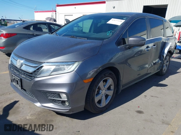 2018 Honda Odyssey EX-L z VIN 5FNRL6H7XJB067694, wystawiony jako IAAI lot #42177338 z przebiegiem 159 670 mil mil oraz . Historia ofert i sprzedaży dostępna na DreamBid. Obrazek 2.