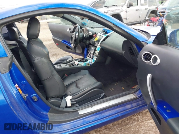 2004 Nissan 350Z Touring with VIN JN1AZ34E04T052916, listed as a IAAI auction lot 41450917 with 157,699 mi miles. Bid and sale history available at carsss.com. Image 5.