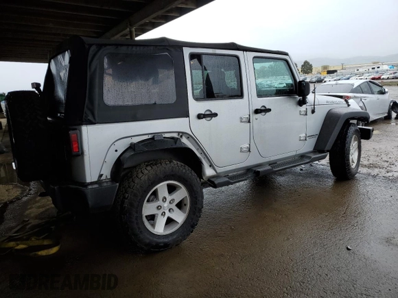 2007 Jeep Wrangler Unlimited Rubicon with VIN 1J4GA69187L127012, listed as a Copart auction lot 48818965 with 61,737 mi miles and Salvage title. Bid and sale history available at DreamBid. Image 3.