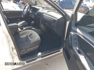 2003 Jeep Grand Cherokee Laredo with VIN 1J4GX48S43C518584, listed as a IAAI auction lot 42213094 with 163,743 mi miles and . Bid and sale history available at DreamBid. Image 5.
