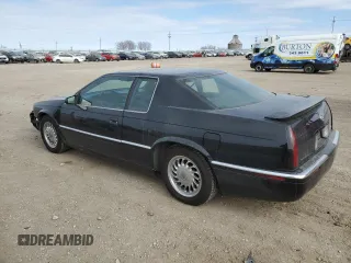 1999 Cadillac Eldorado Touring z VIN 1G6ET1298XU602343, wystawiony jako Copart lot #44327195 z przebiegiem 52 327 mil mil oraz Szkody całkowita. Historia ofert i sprzedaży dostępna na DreamBid. Obrazek 2.