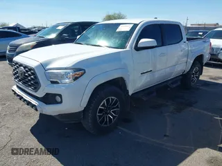 2021 Toyota Tacoma SR with VIN 3TYAX5GN5MT014868, listed as a IAAI auction lot 41549927 with 30,653 mi miles and . Bid and sale history available at DreamBid. Image 2.