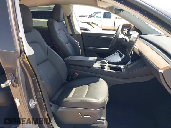 2024 Tesla Model Y with VIN 7SAYGDED2RF040745, listed as a IAAI auction lot 41986613 with 9,778 mi miles and . Bid and sale history available at DreamBid. Image 5.