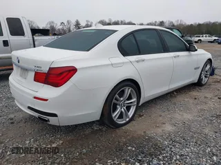 2014 BMW 7 Series 740i with VIN WBAYA6C51ED144387, listed as a IAAI auction lot 41226638 with 161,448 mi miles. Bid and sale history available at carsss.com. Image 4.